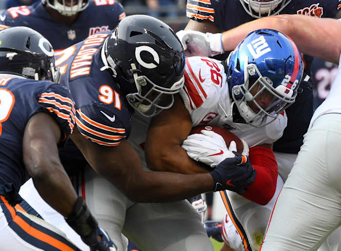 Chicago Bears nose tackle Eddie Goldman (91) tackles Giants RB Saquon Barkley (26). Mandatory Credit: Mike DiNovo-USA TODAY Sports